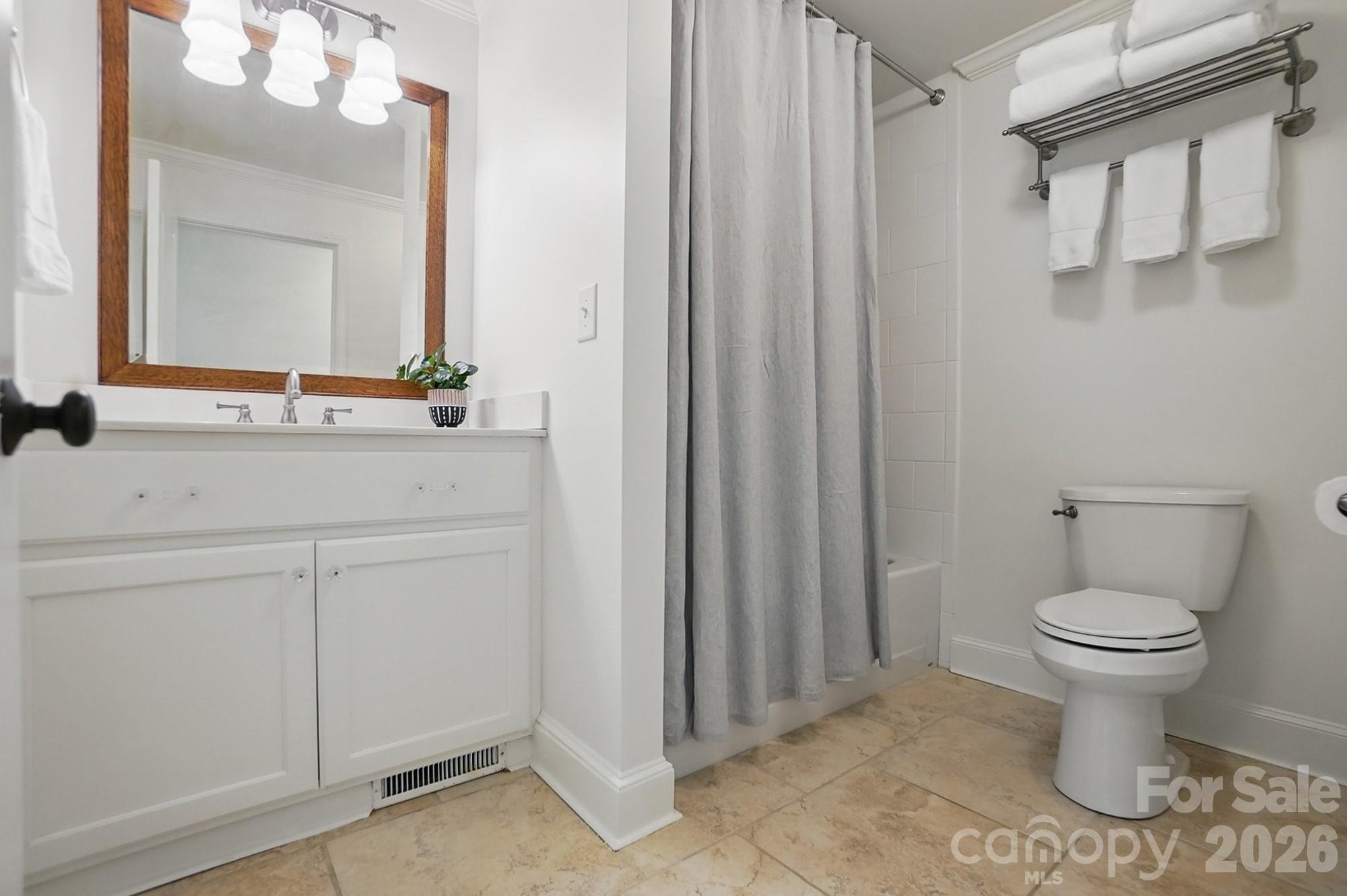 411 Baucom Deese Road Monroe, NC 28110 - Photo 27 of 45 a bathroom with a sink a toilet and a mirror