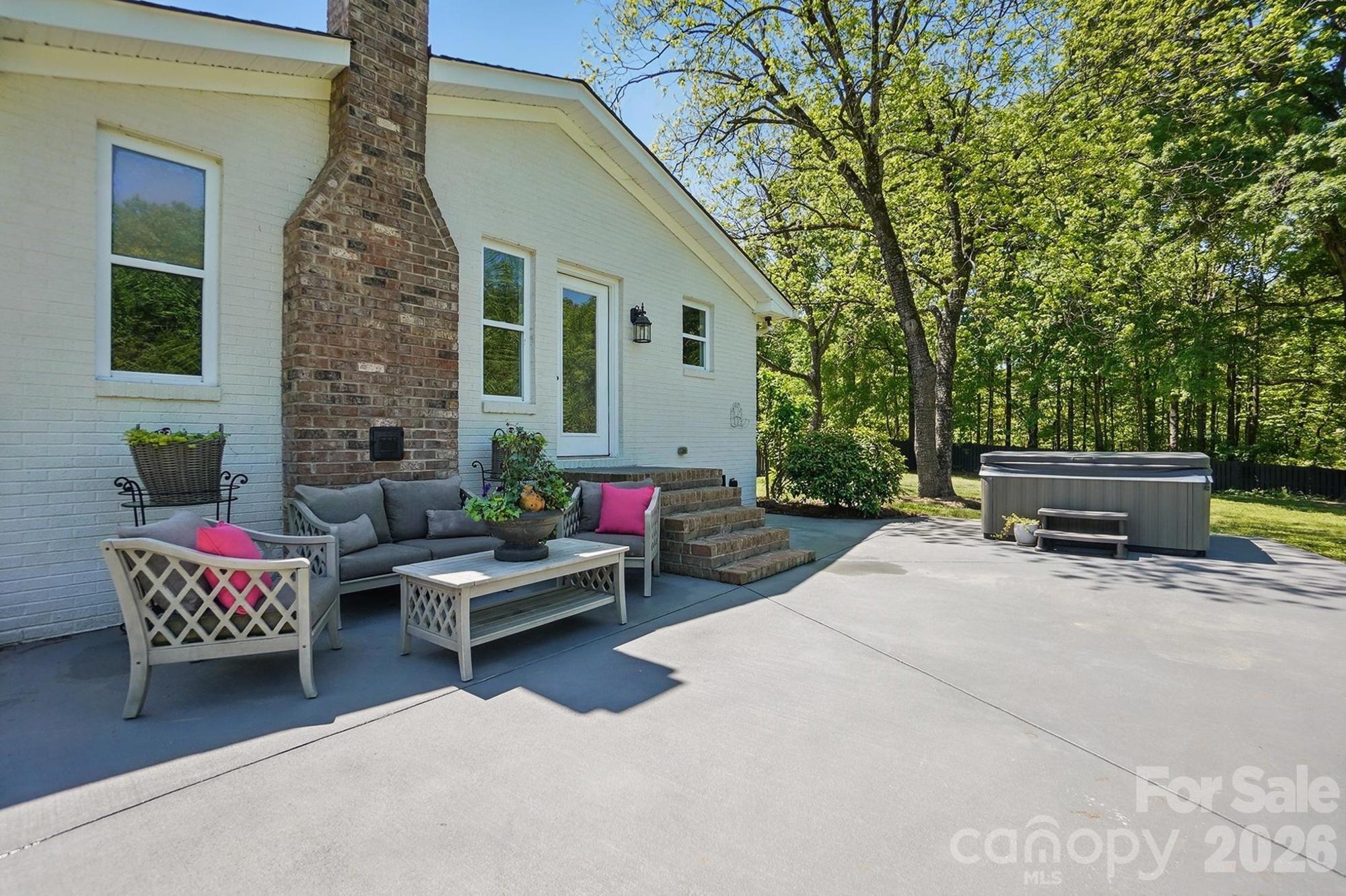 411 Baucom Deese Road Monroe, NC 28110 - Photo 41 of 45 a view of a patio with a couch and a fire pit