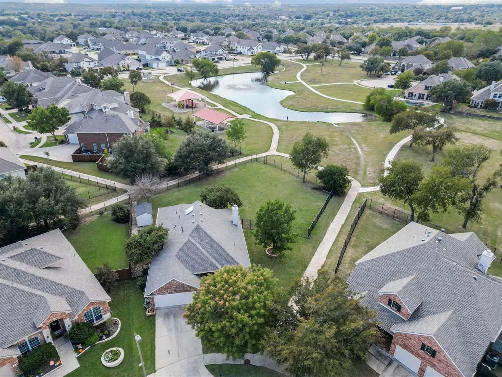 Aerial overview of property's location featuring nearby suburban area and a large body of water