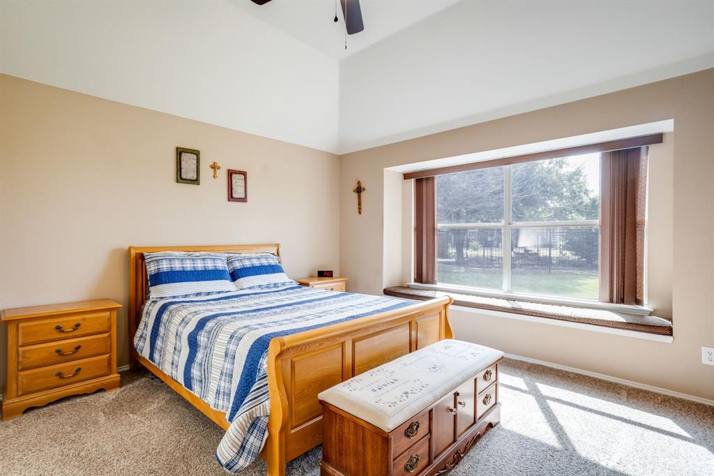 6403 Highland Crest Lane Sachse, TX 75048 - Photo 14 of 40 Bedroom featuring light carpet and a ceiling fan