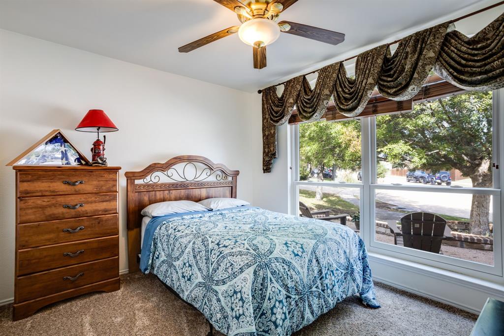 6403 Highland Crest Lane Sachse, TX 75048 - Photo 18 of 40 Bedroom featuring carpet flooring and ceiling fan