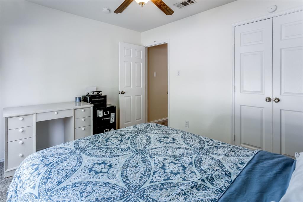 6403 Highland Crest Lane Sachse, TX 75048 - Photo 19 of 40 Bedroom with a ceiling fan and a closet