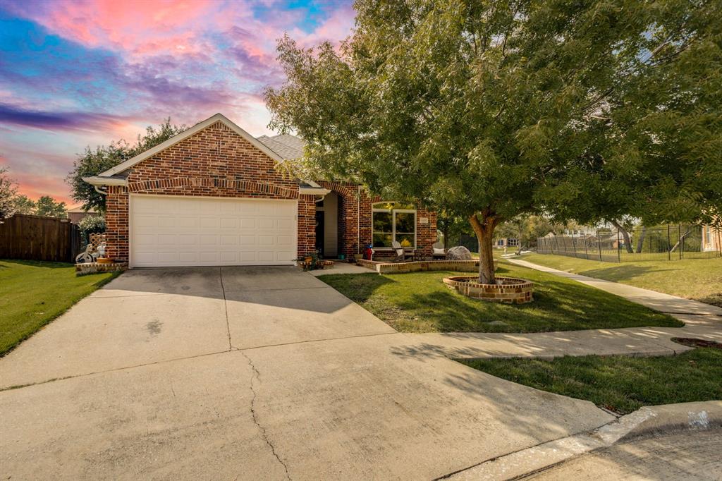 6403 Highland Crest Lane Sachse, TX 75048 - Photo 2 of 40 View of front of house featuring brick siding, concrete driveway, and an attached garage