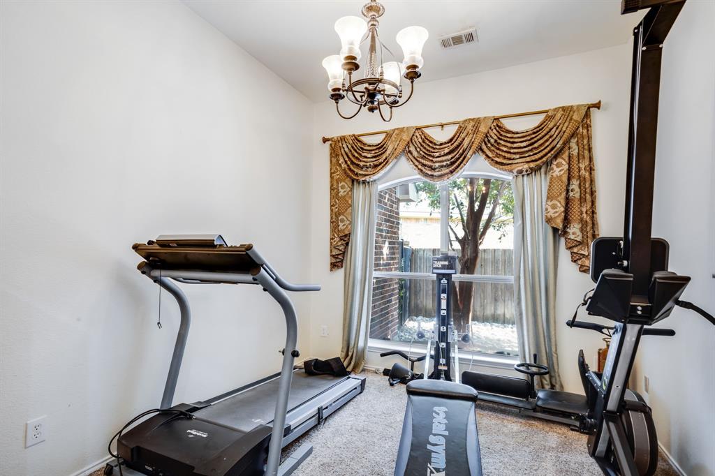 6403 Highland Crest Lane Sachse, TX 75048 - Photo 21 of 40 Workout area featuring carpet and a chandelier
