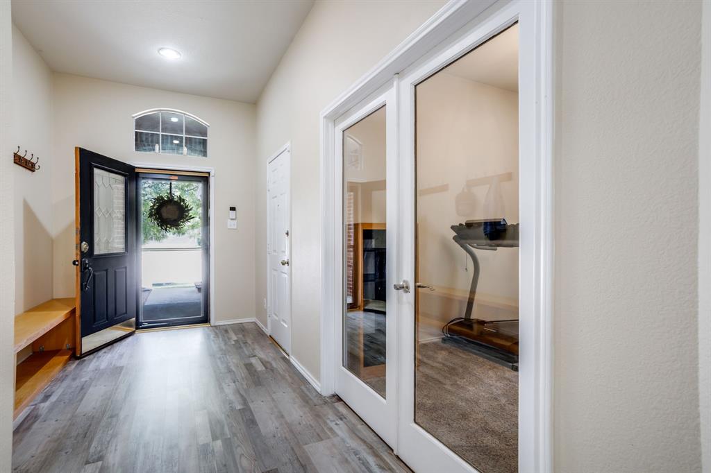6403 Highland Crest Lane Sachse, TX 75048 - Photo 6 of 40 Foyer featuring wood finished floors and french doors