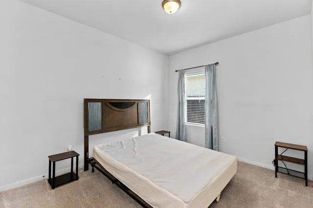 a bathroom with a shower a toilet and a sink