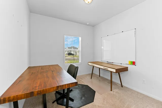 a bed room with a bed and a chandelier