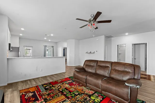 a living room with kitchen and a couch