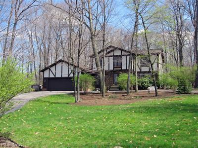 6985 Liberty Road Solon, OH 44139 - Photo 1 of 1 Lovely tudor style colonial on private wooded setting