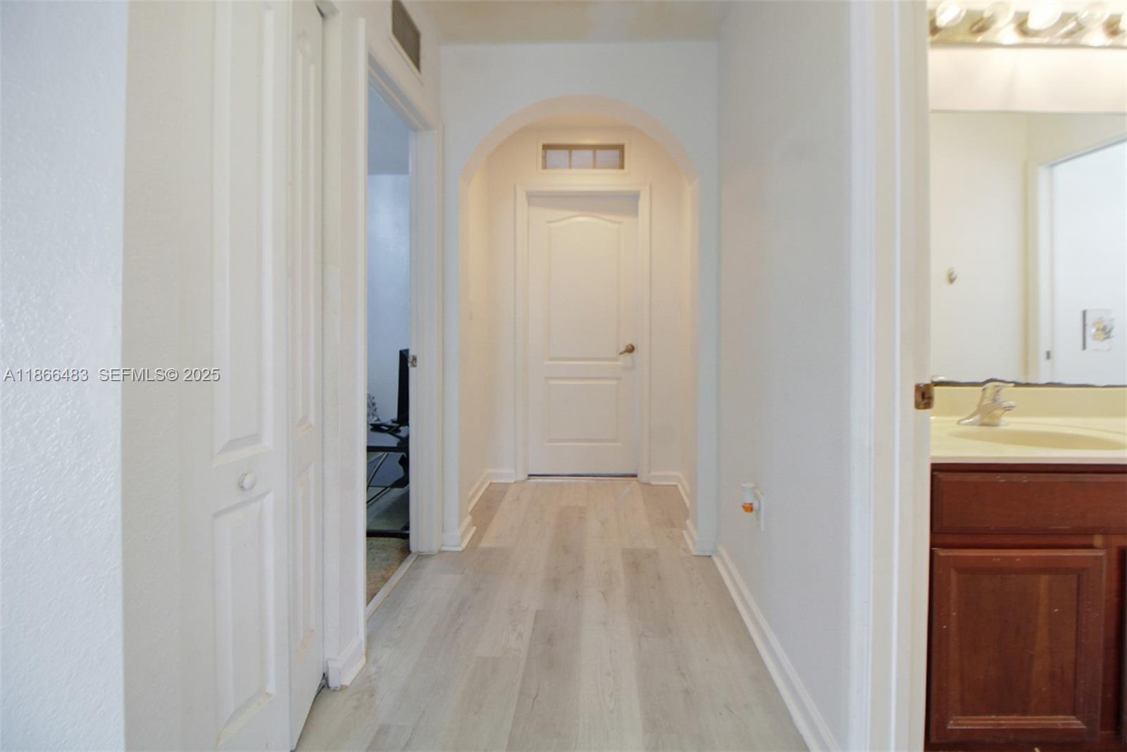 14077 Southwest 274th Terrace Homestead, FL 33032 - Photo 16 of 29 a view of a hallway with wooden floor
