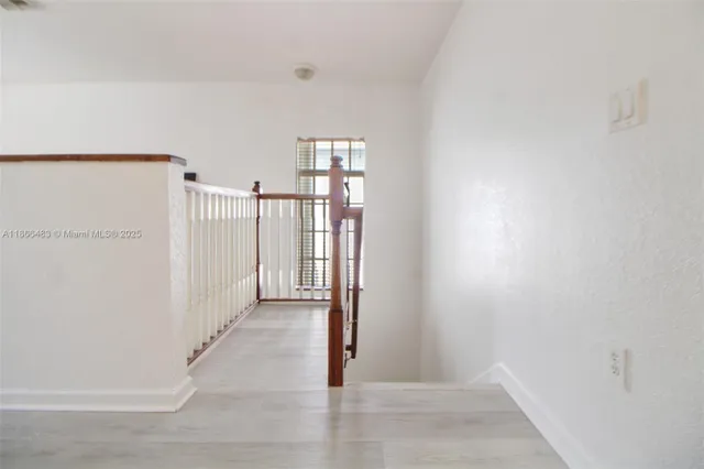 a bathroom with a toilet and shower curtain