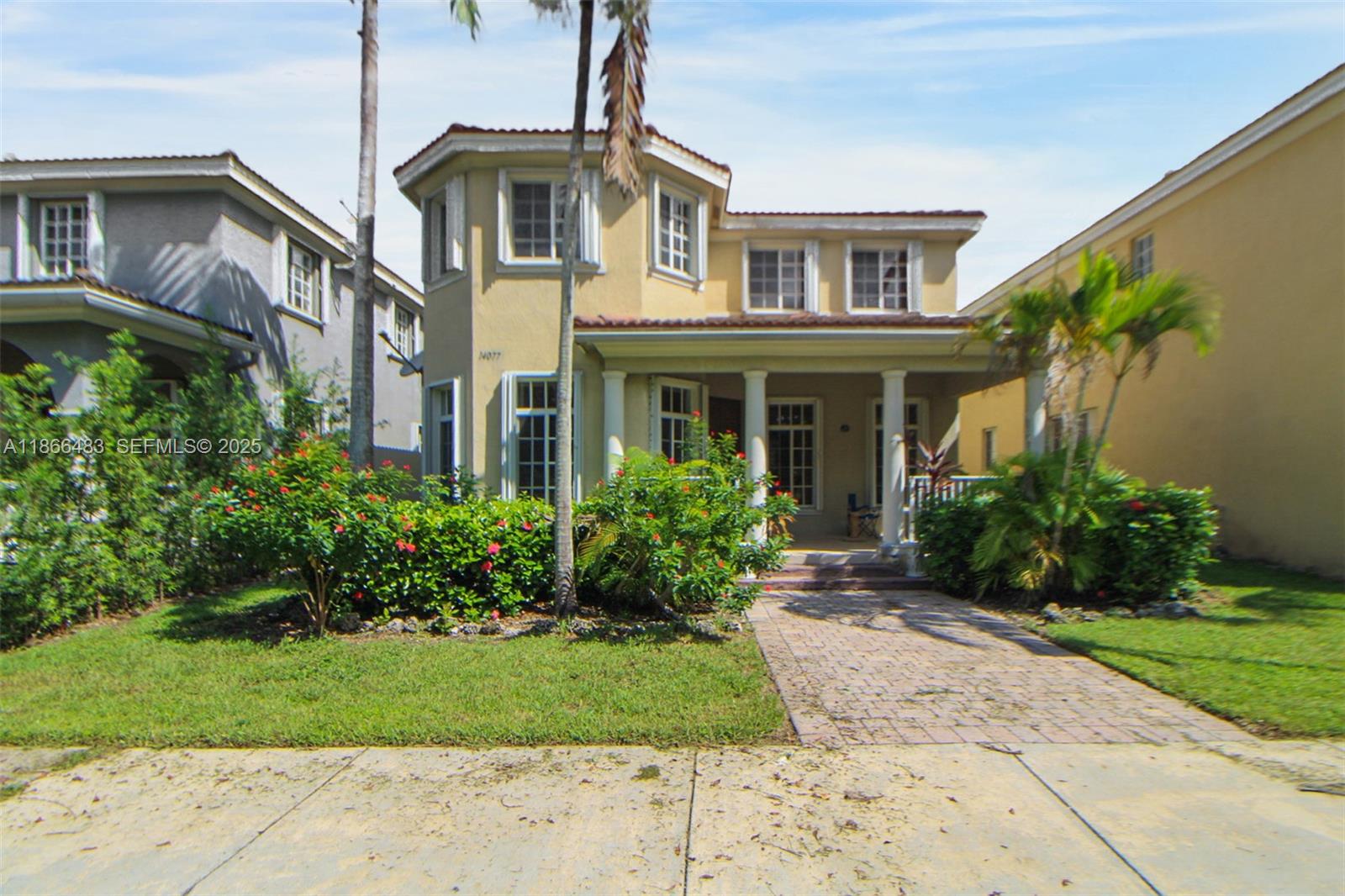 14077 Southwest 274th Terrace Homestead, FL 33032 - Photo 22 of 29 a front view of a house with garden