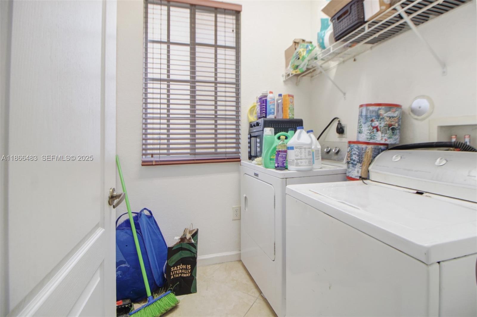 14077 Southwest 274th Terrace Homestead, FL 33032 - Photo 23 of 29 a room with storage and utility