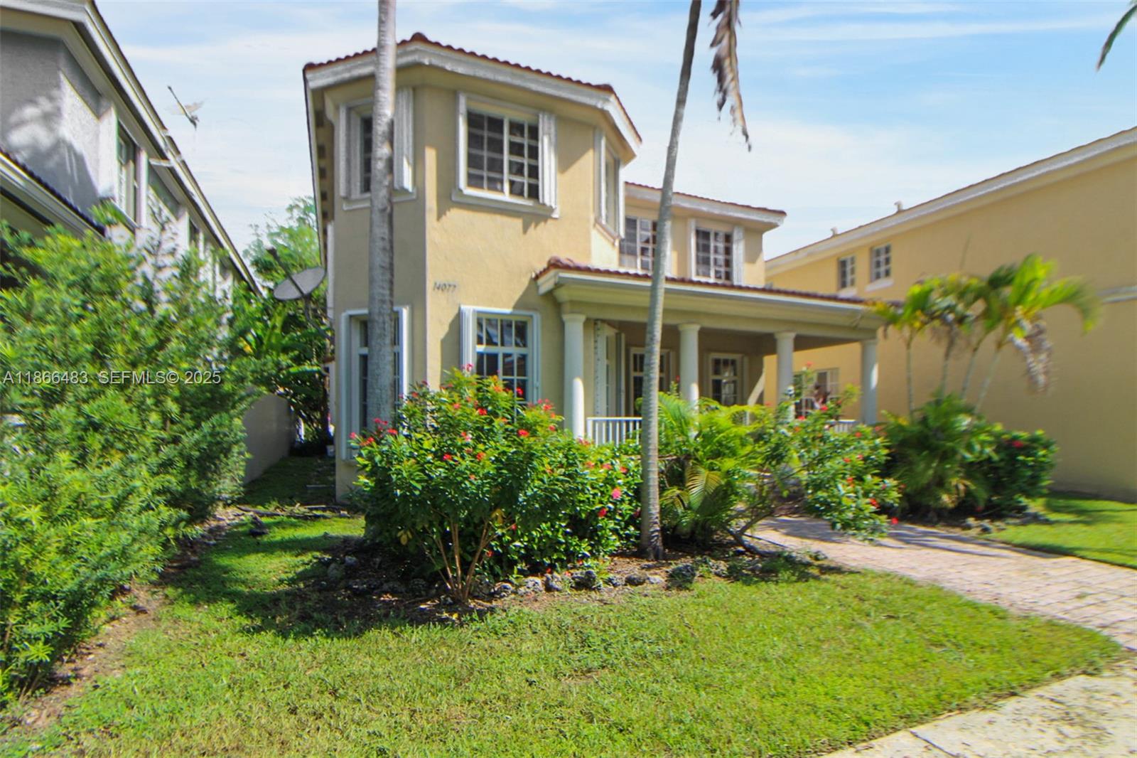 14077 Southwest 274th Terrace Homestead, FL 33032 - Photo 28 of 29 a front view of a house with a yard