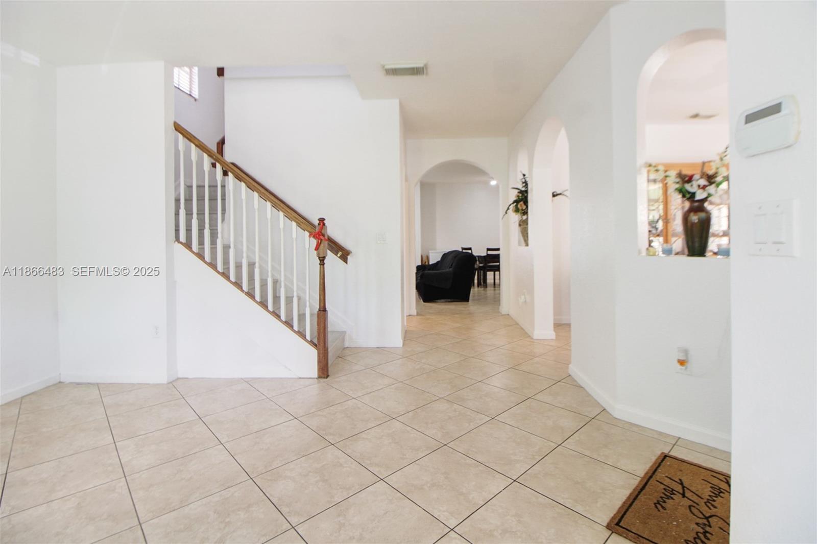 14077 Southwest 274th Terrace Homestead, FL 33032 - Photo 29 of 29 a view of a hallway view with staircase