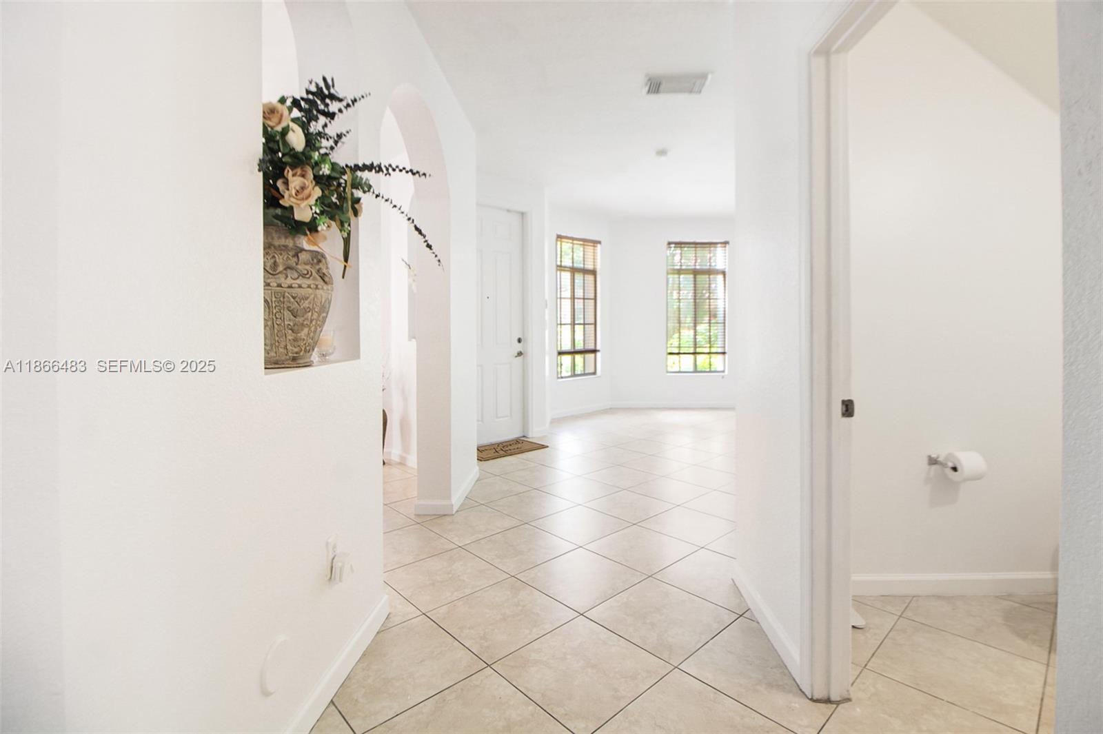 14077 Southwest 274th Terrace Homestead, FL 33032 - Photo 6 of 29 a view of an entryway with wooden floor