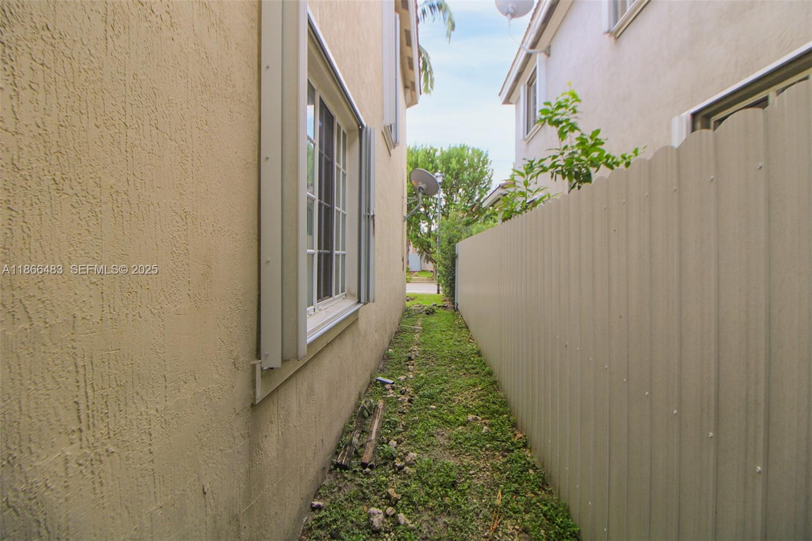 14077 Southwest 274th Terrace Homestead, FL 33032 - Photo 9 of 29 a view of a pathway with flower plants