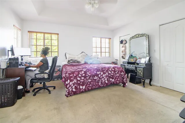 a bedroom with a bed furniture and a window