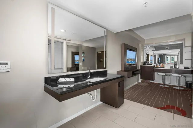 a kitchen with a sink and a stove top oven