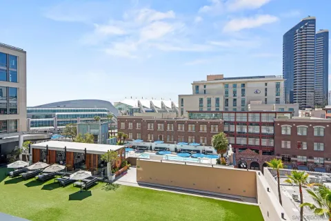 a view of a swimming pool with a patio and a tub