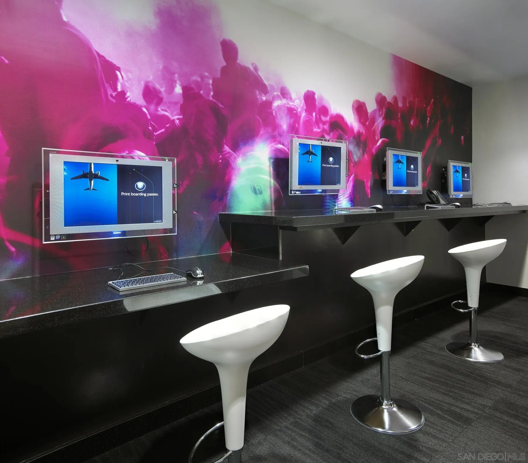 207 Fifth Avenue, Unit 739 San Diego, CA 92101 - Photo 24 of 30 a bathroom with a sink and a mirror