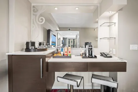 a kitchen with stainless steel appliances granite countertop a sink and a refrigerator