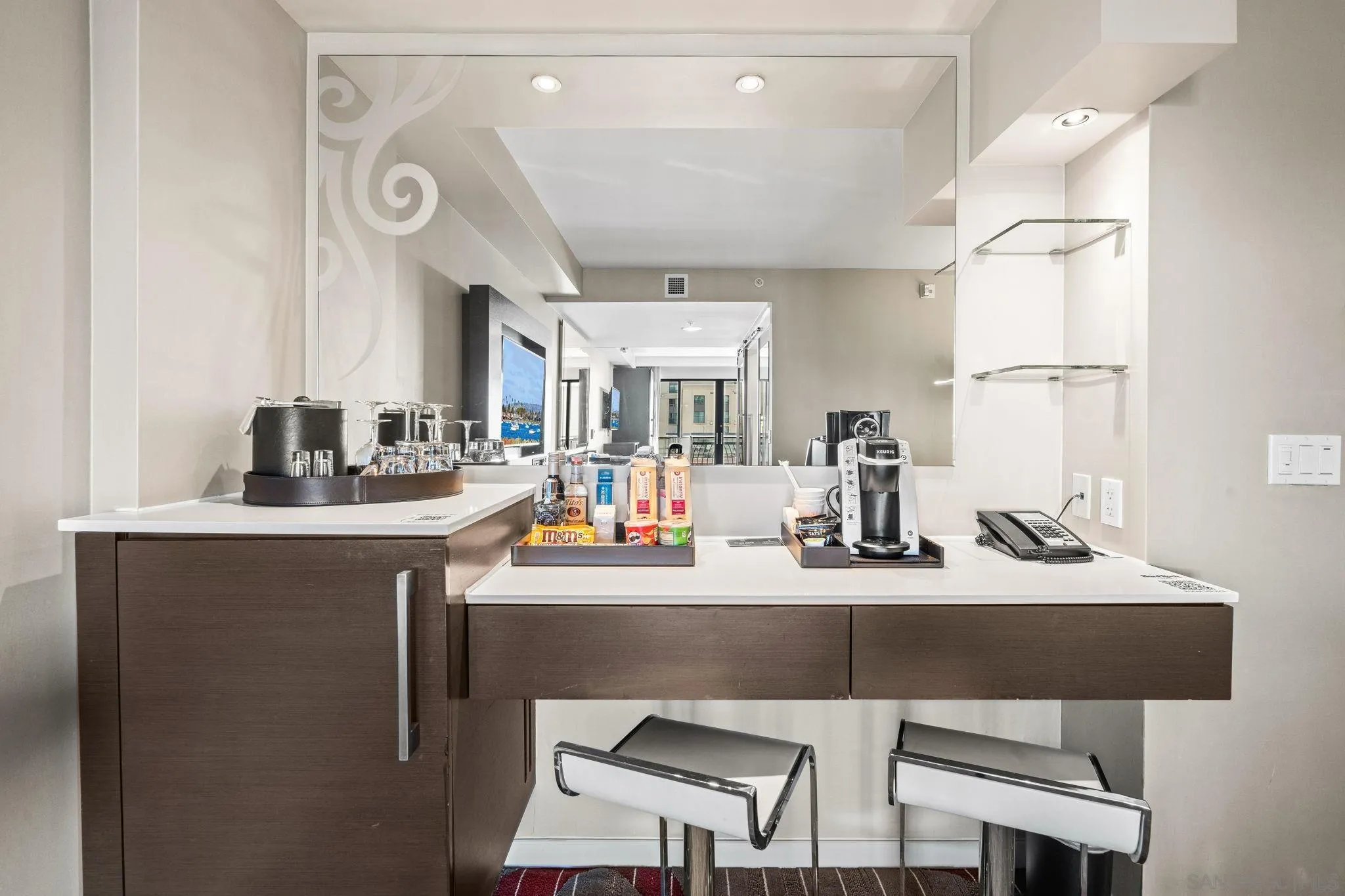 207 Fifth Avenue, Unit 739 San Diego, CA 92101 - Photo 6 of 30 a kitchen with stainless steel appliances granite countertop a sink and a refrigerator