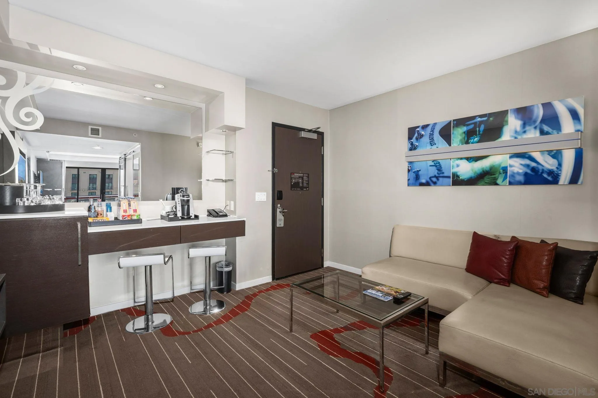 207 Fifth Avenue, Unit 739 San Diego, CA 92101 - Photo 10 of 30 a living room with furniture and a wooden floor