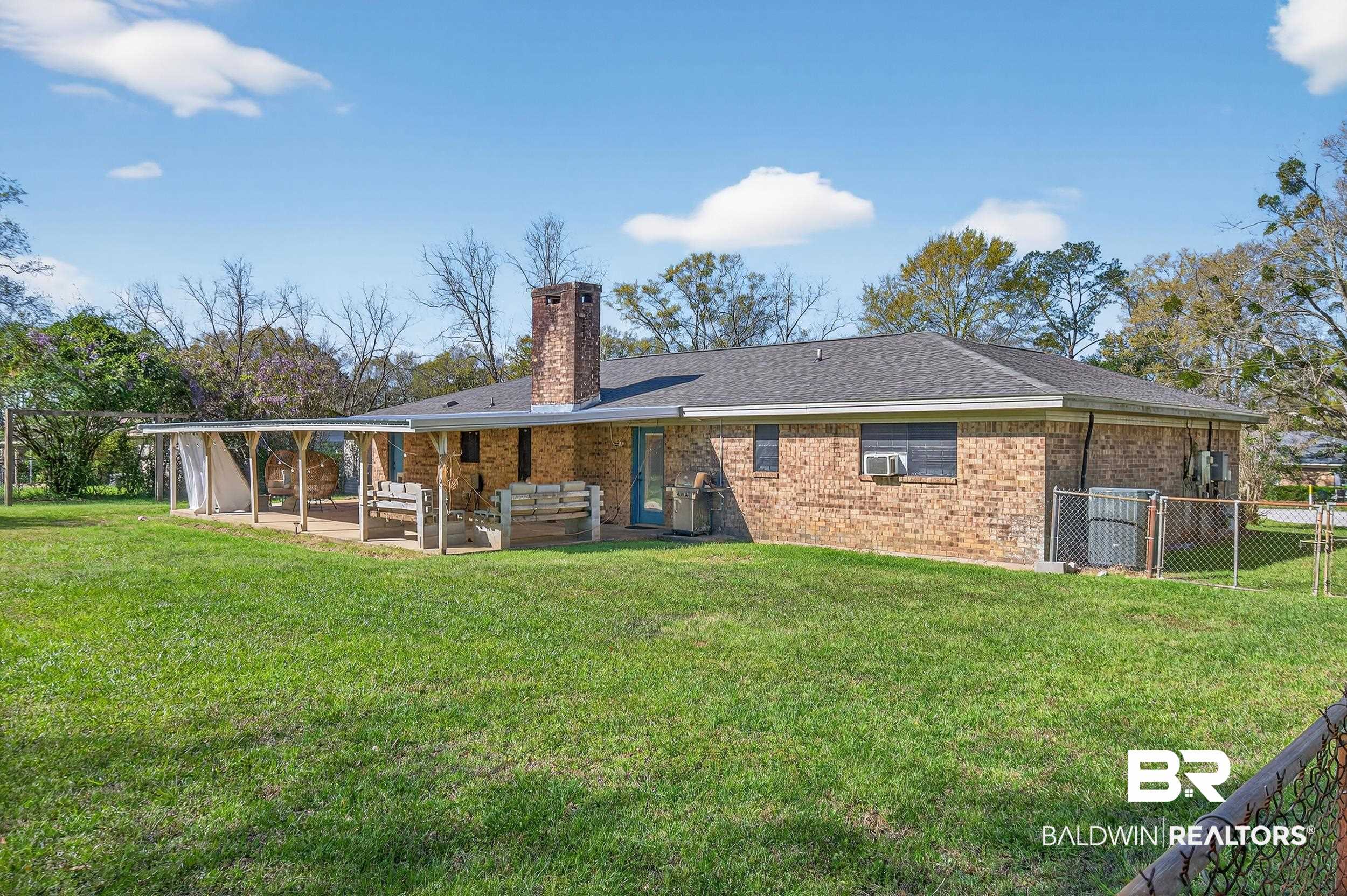 46006 Pecan Lane Bay Minette, AL 36507 - Photo 33 of 40 Rear view of property featuring a patio, a chimney, brick siding, and an outdoor hangout area