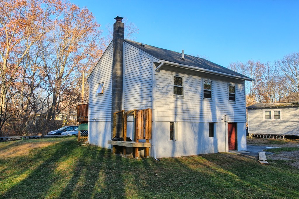 16 Loon Road Billerica, MA 01821 - Photo 18 of 24 a front view of a house with a yard