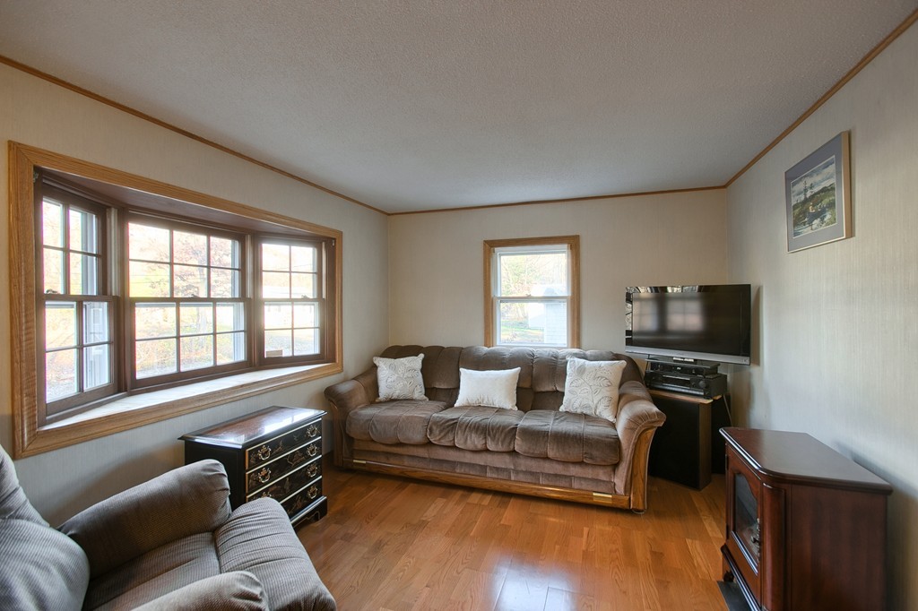 16 Loon Road Billerica, MA 01821 - Photo 3 of 24 a living room with furniture and a flat screen tv