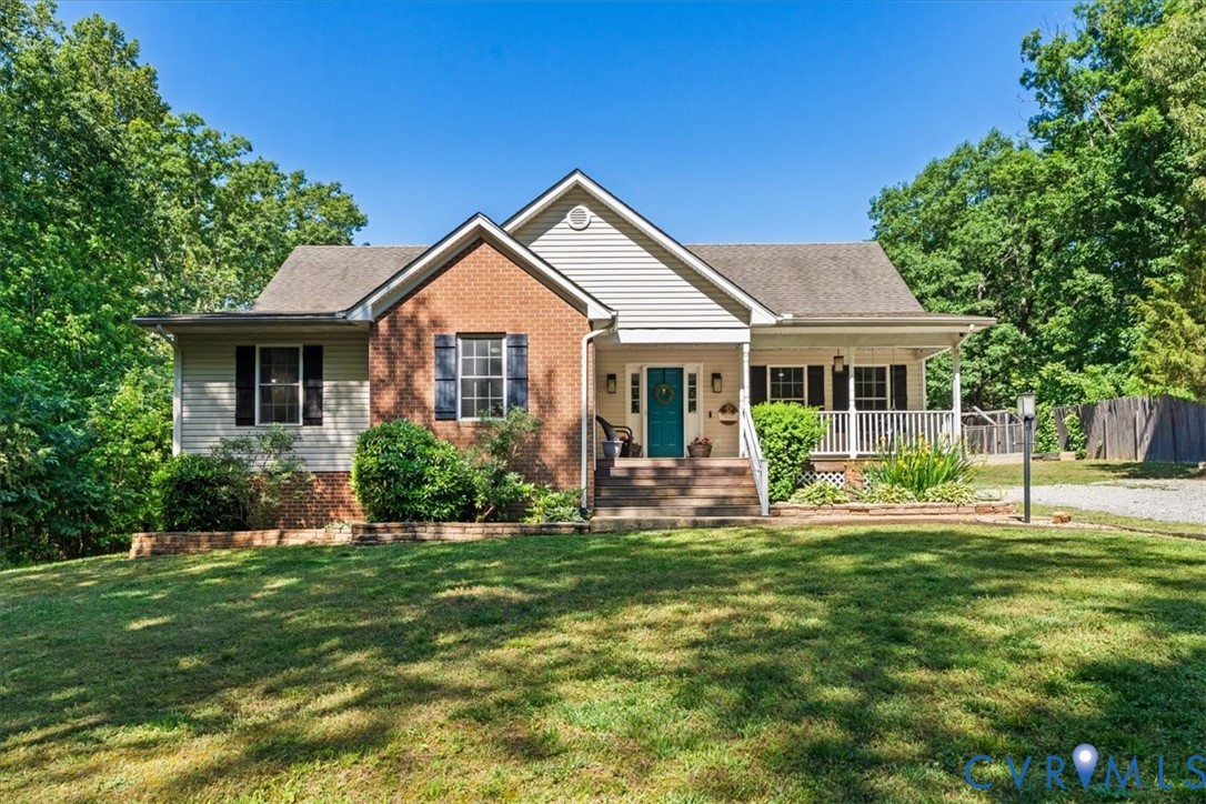 2043 Rocky Ford Road Powhatan, VA 23139 - Photo 78 of 78 a front view of a house with a yard table and chairs