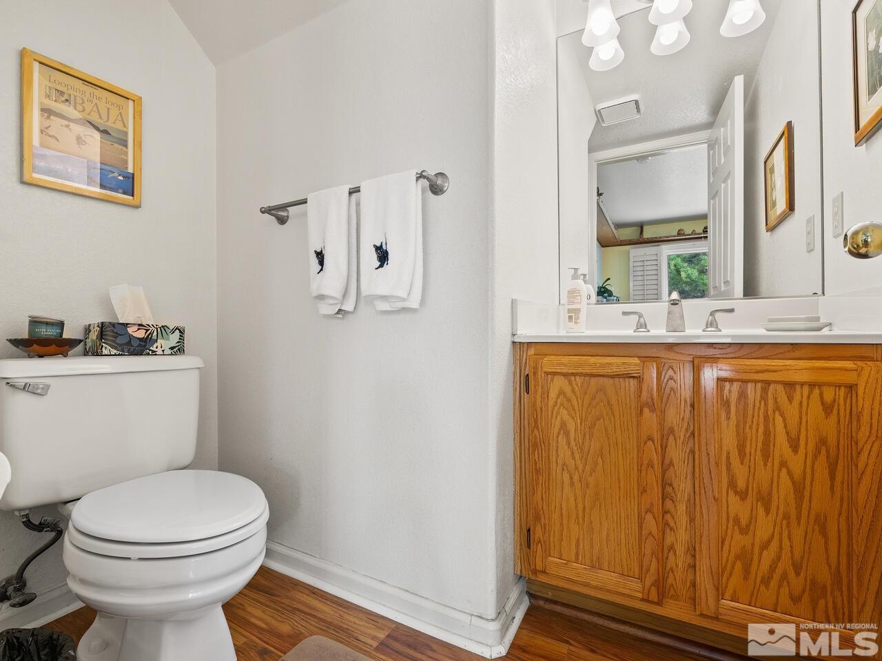 7593 Whimbleton Way Reno, NV 89511 - Photo 11 of 19 a bathroom with a sink a toilet and shower