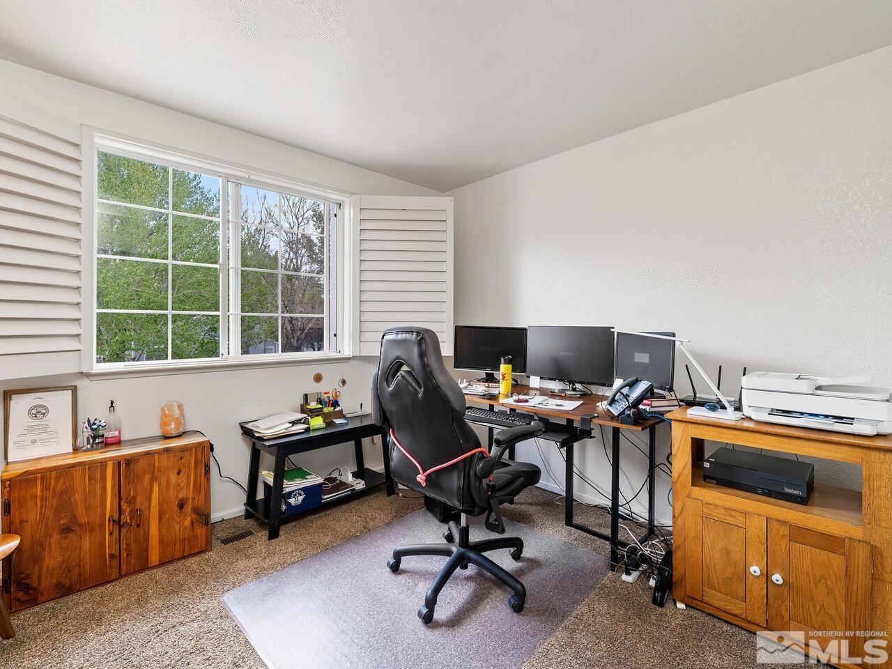 7593 Whimbleton Way Reno, NV 89511 - Photo 15 of 19 a view of a workspace with furniture and a window