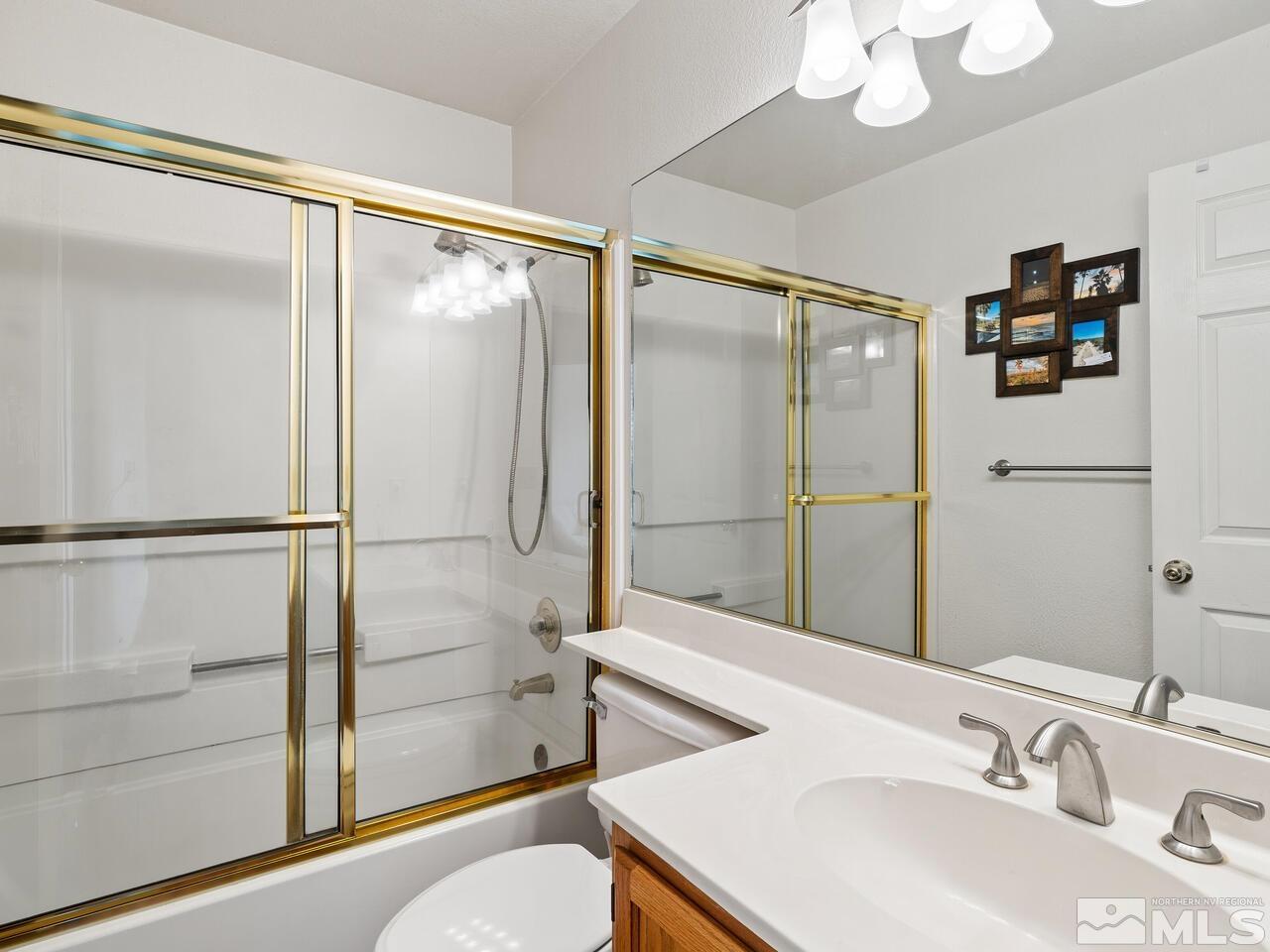 7593 Whimbleton Way Reno, NV 89511 - Photo 16 of 19 a bathroom with a sink and a mirror