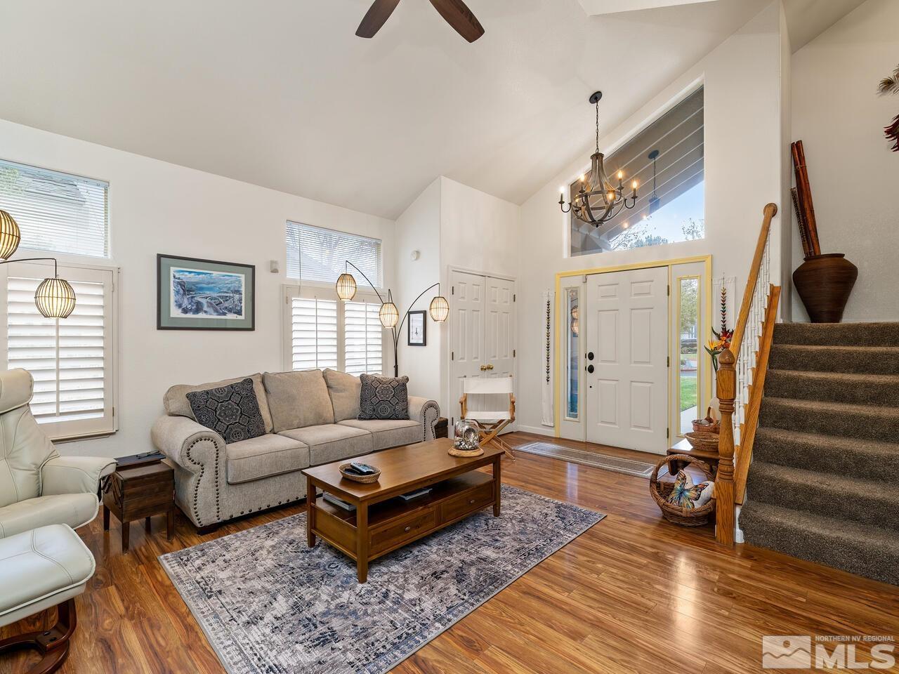 7593 Whimbleton Way Reno, NV 89511 - Photo 4 of 19 a living room with furniture a rug and a window