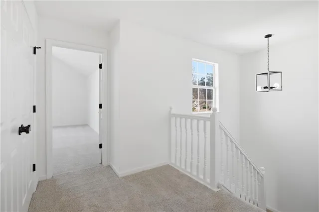 a view of an empty room with windows