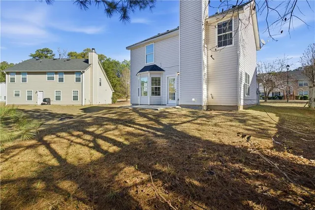 a big room with table and chairs