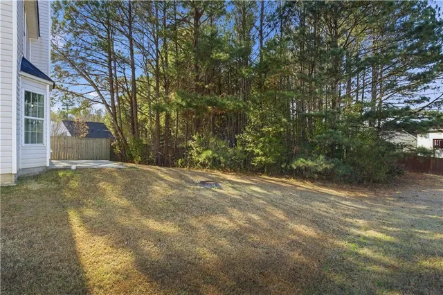 a view of a yard with a tree