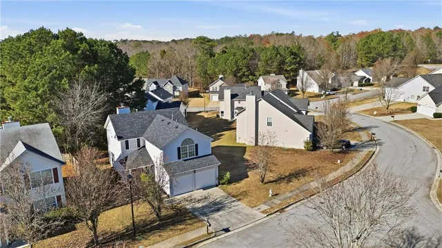 a view of a house with a mountain in the background
