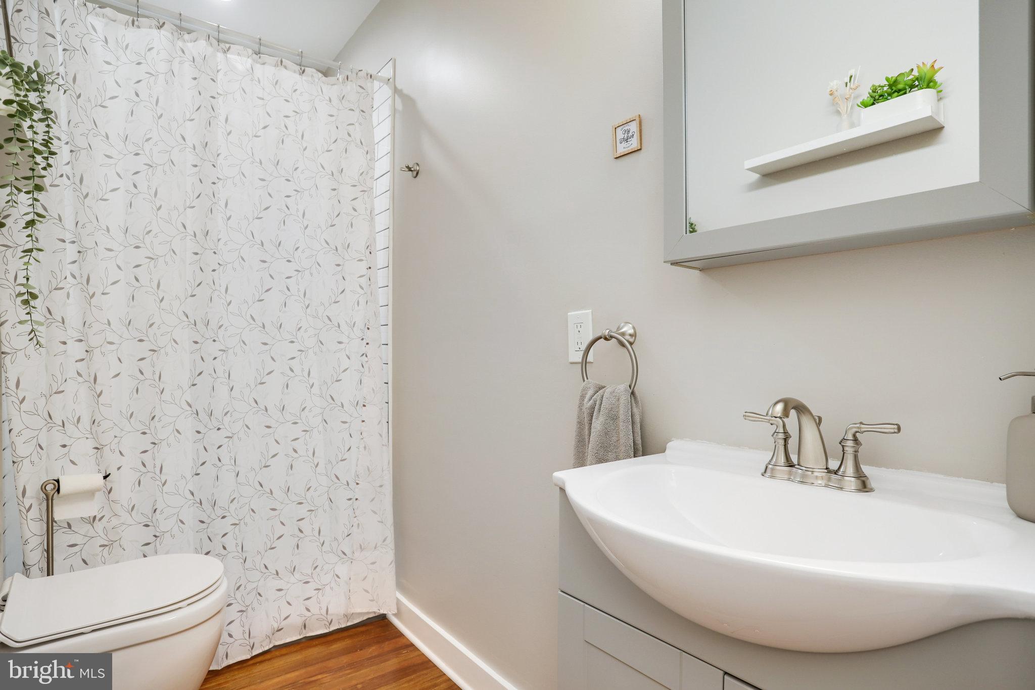 1507 A Street Northeast Washington, DC 20002 - Photo 27 of 57 Sleek hall BA, 2 of 2 upstairs, has tiled shower