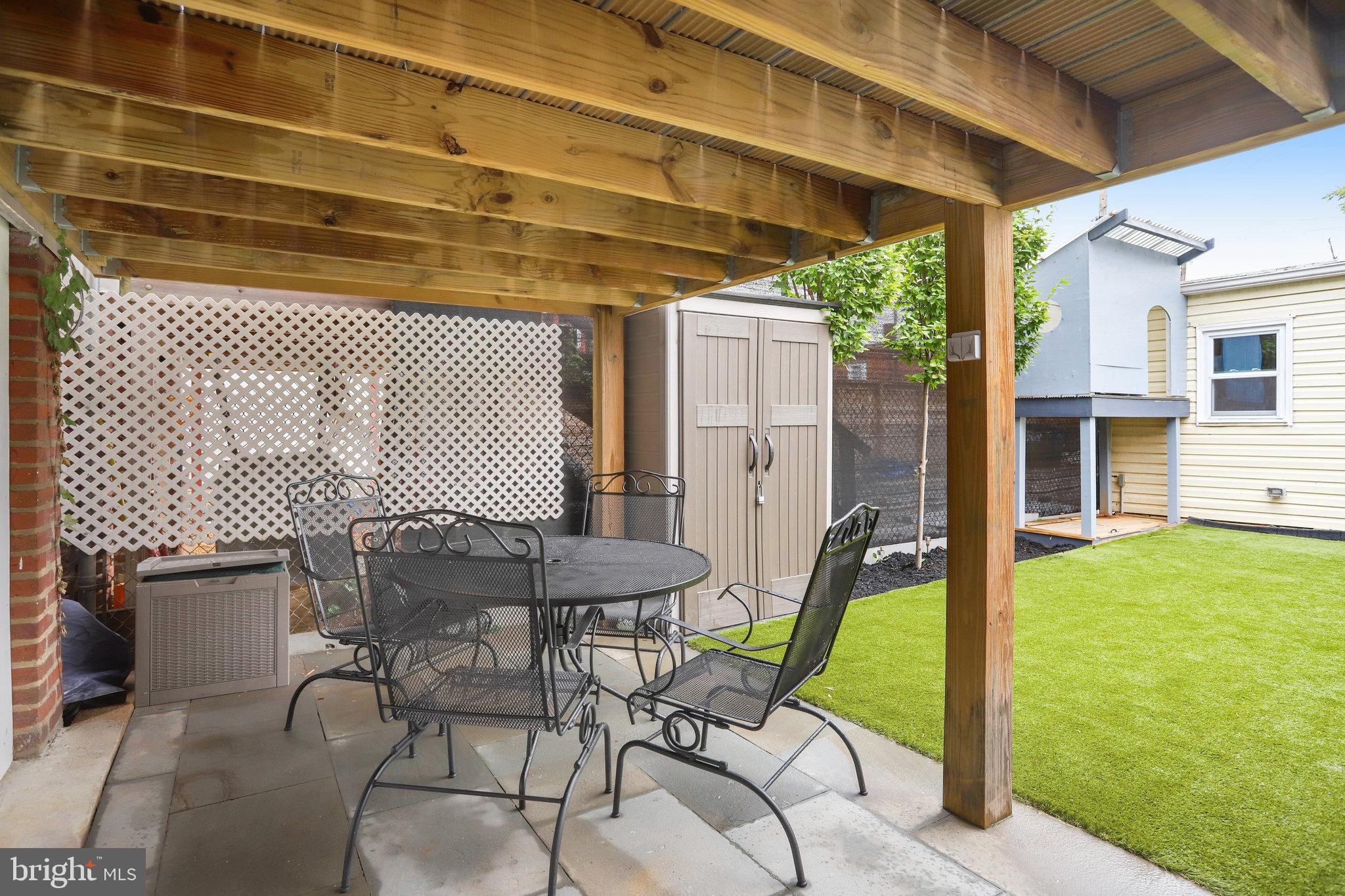 1507 A Street Northeast Washington, DC 20002 - Photo 41 of 57 Blue stone patio underneath deck, outside workshop