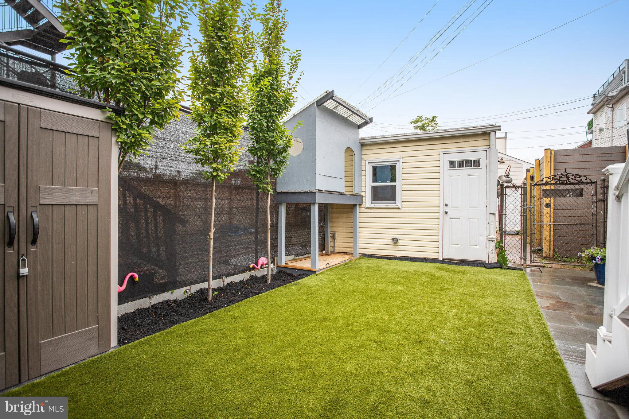 1507 A Street Northeast Washington, DC 20002 - Photo 42 of 57 Evergreen turf backyd, treehouse, storage garage