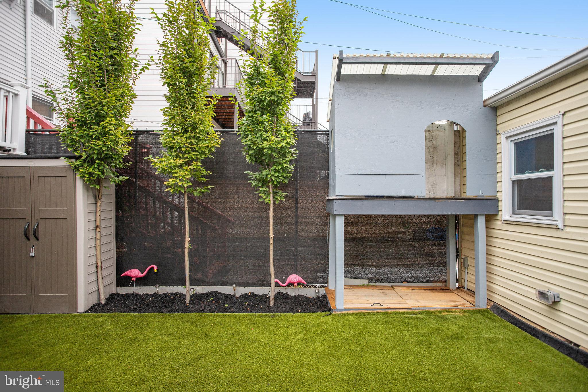 1507 A Street Northeast Washington, DC 20002 - Photo 43 of 57 Shed, treehouse + sandbox next to storage garage