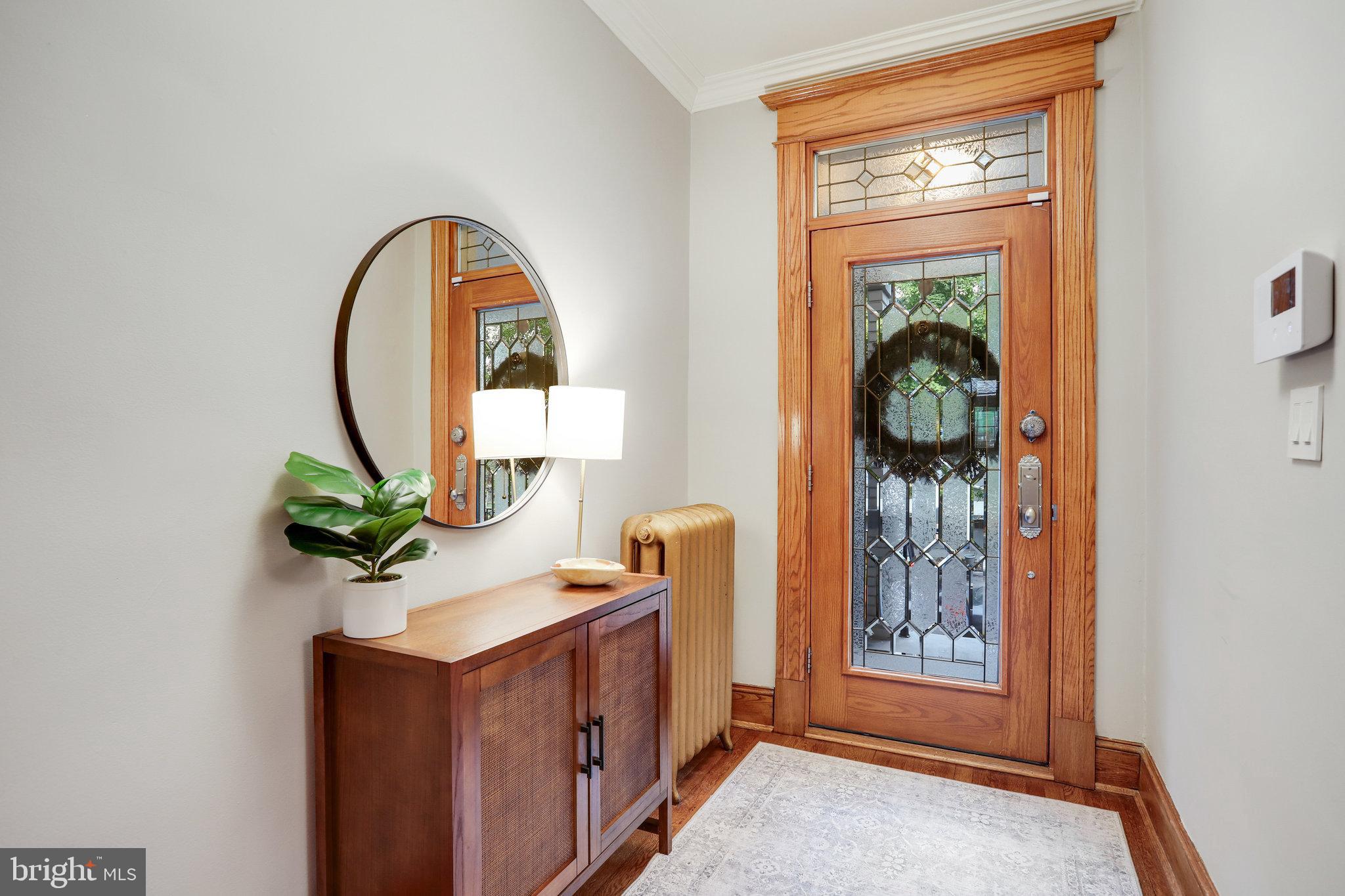 1507 A Street Northeast Washington, DC 20002 - Photo 4 of 57 Stately leaded-glass front door, space for a bench
