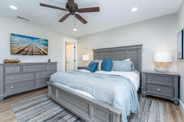 a bedroom with a bed and a dresser