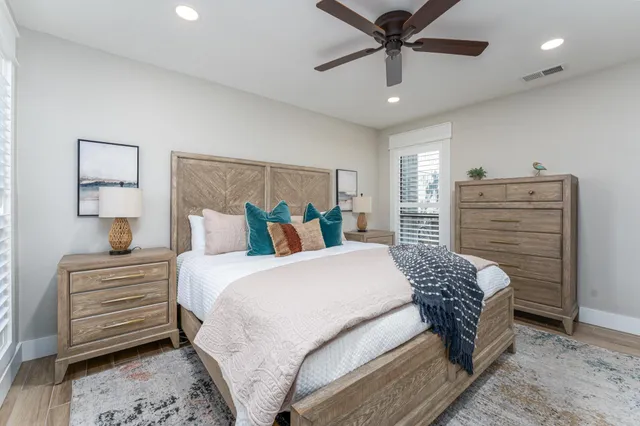 a bedroom with a bed and a chandelier