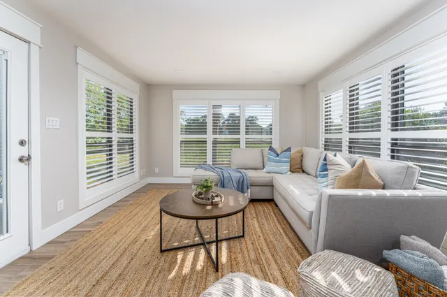 a living room with furniture and a window