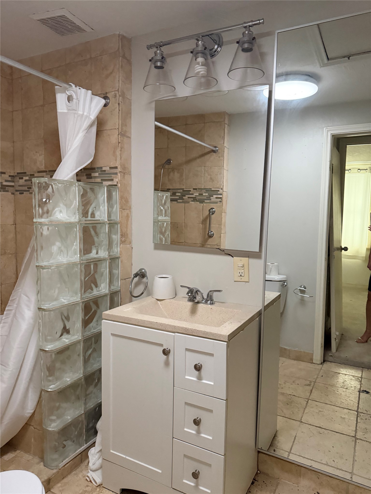 703 76th Street Houston, TX 77012 - Photo 18 of 23 a bathroom with a sink and a mirror