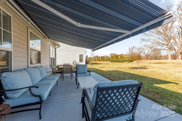 a view of swimming pool with outdoor seating